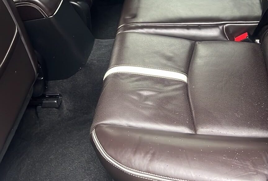 Rear passenger carpet restored after professional mould remediation and odour removal.
