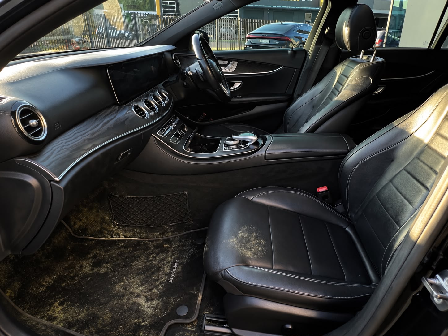 Vehicle interior showing mould growing on carpets before professional mould remediation.

