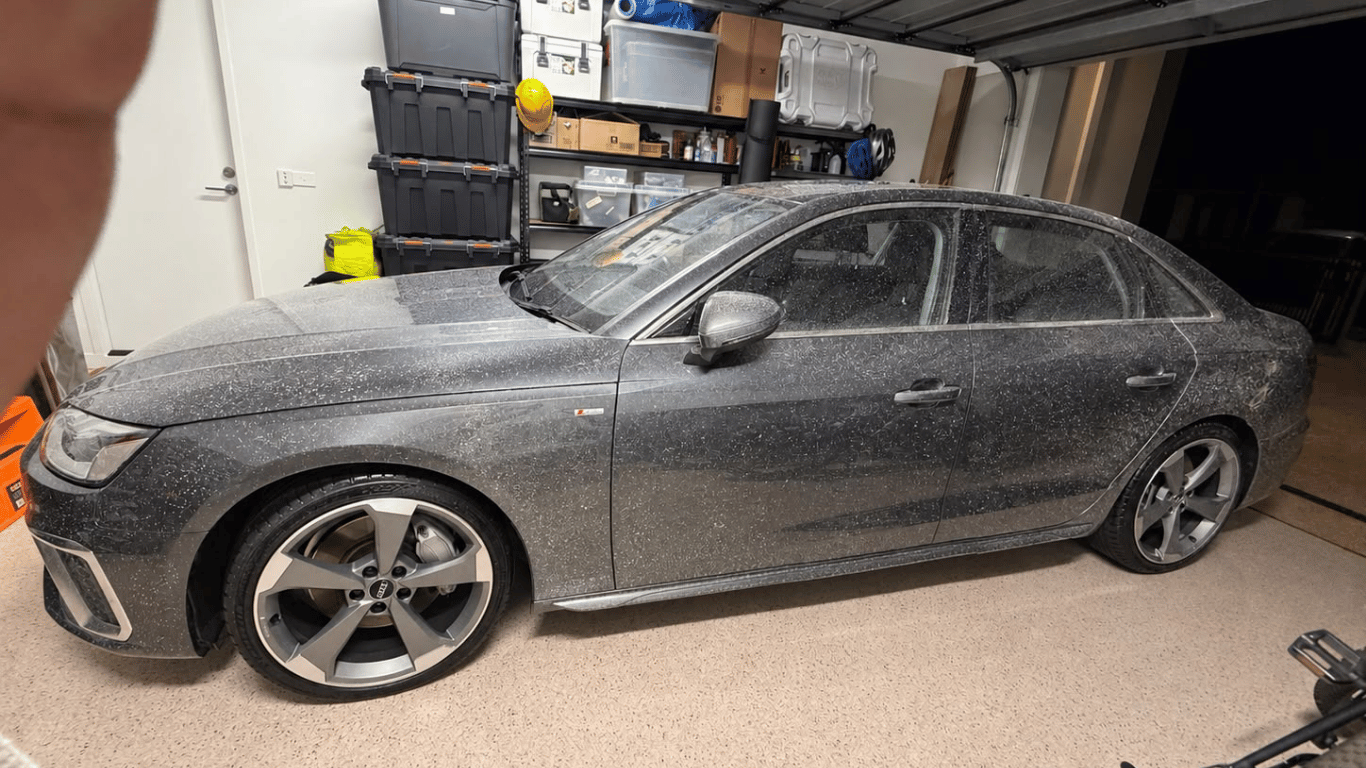 Audi concrete and paint overspray before restoration